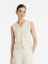 A lady wears a vest.
